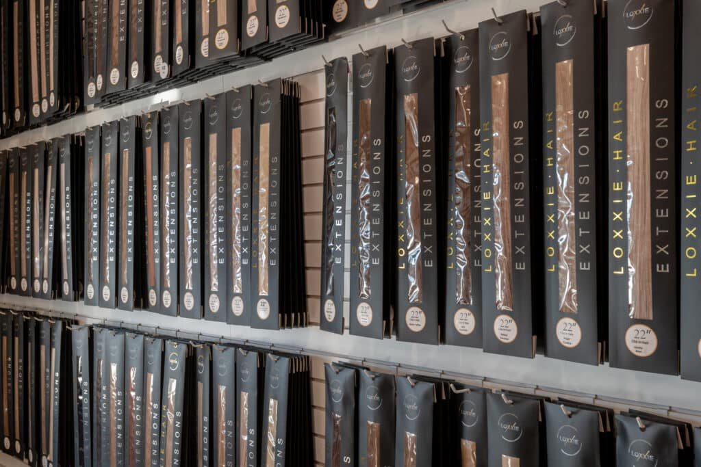 A large display of books neatly arranged on shelves, showcasing a variety of titles and genres.