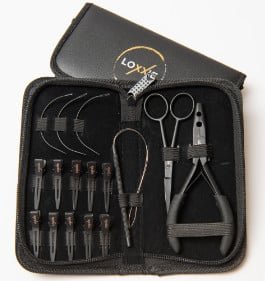 A black case containing various tools for Loxxie hair styling and maintenance.